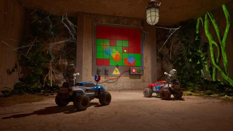 Two RC cars, one blue and one red, facing a wall-mounted grid of red and green buttons with a magnet cable and red and green push buttons below it